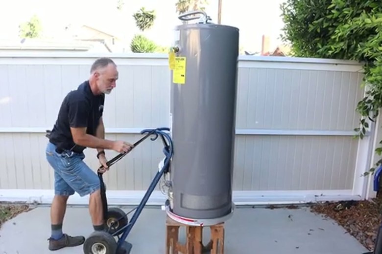 Rolling a water heater out on the stair dolly