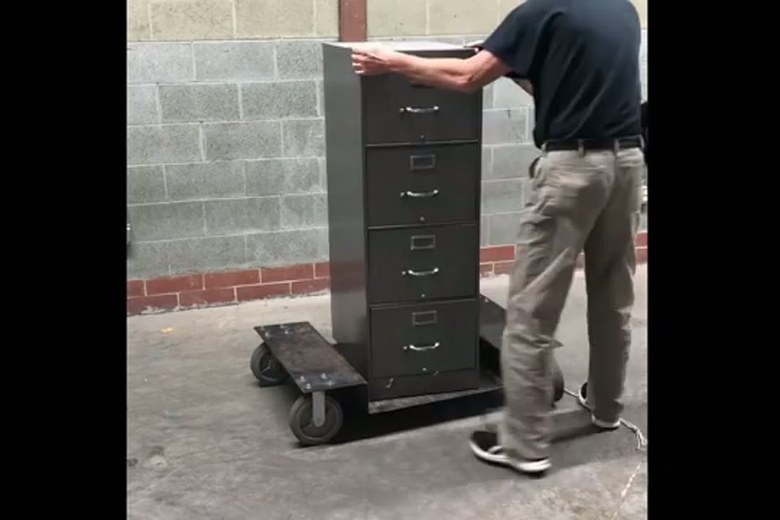Wheeling a filing cabinet out to the truck